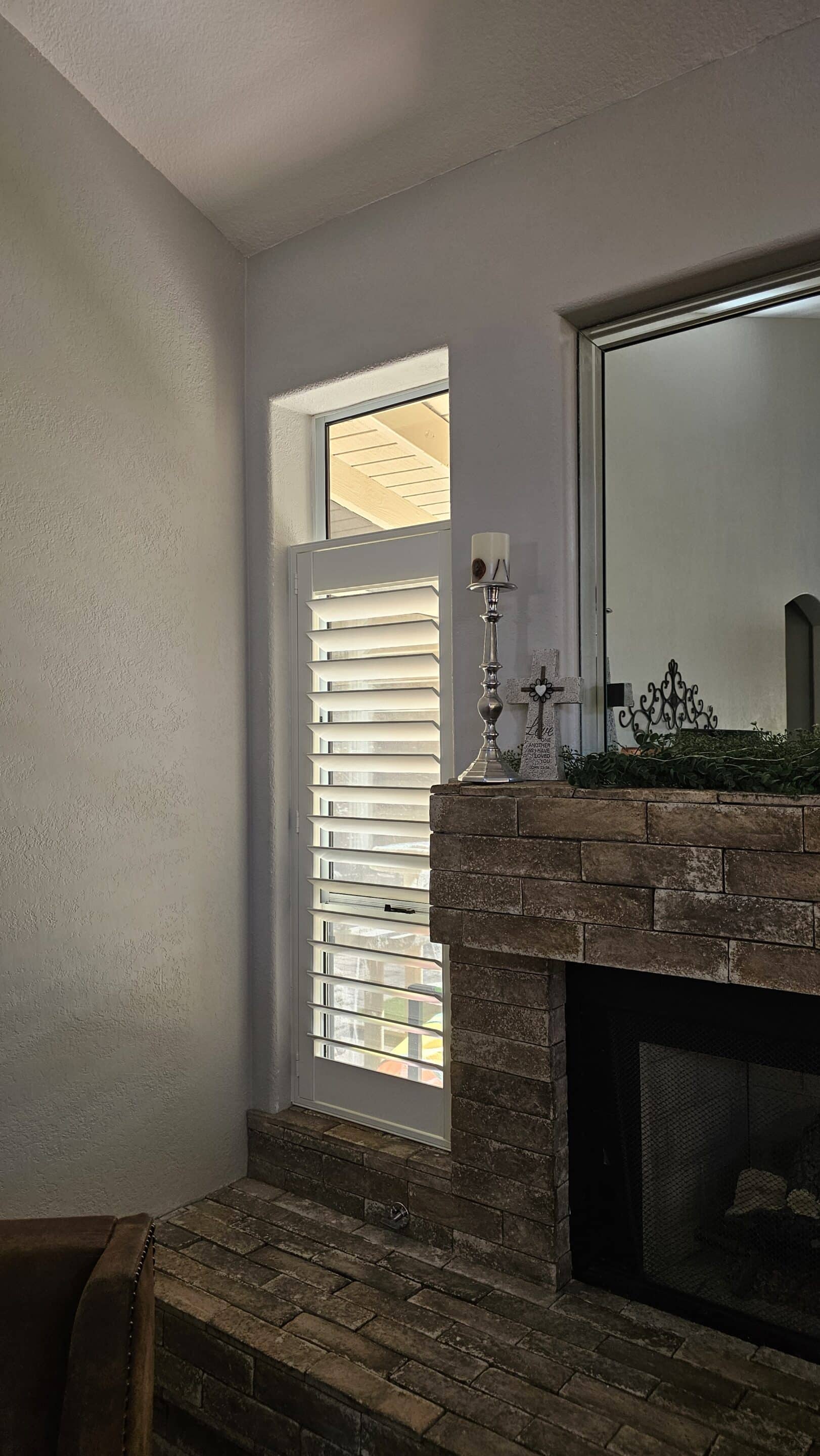 Composite white plantation shutter in Prescott AZ in a Living Room.