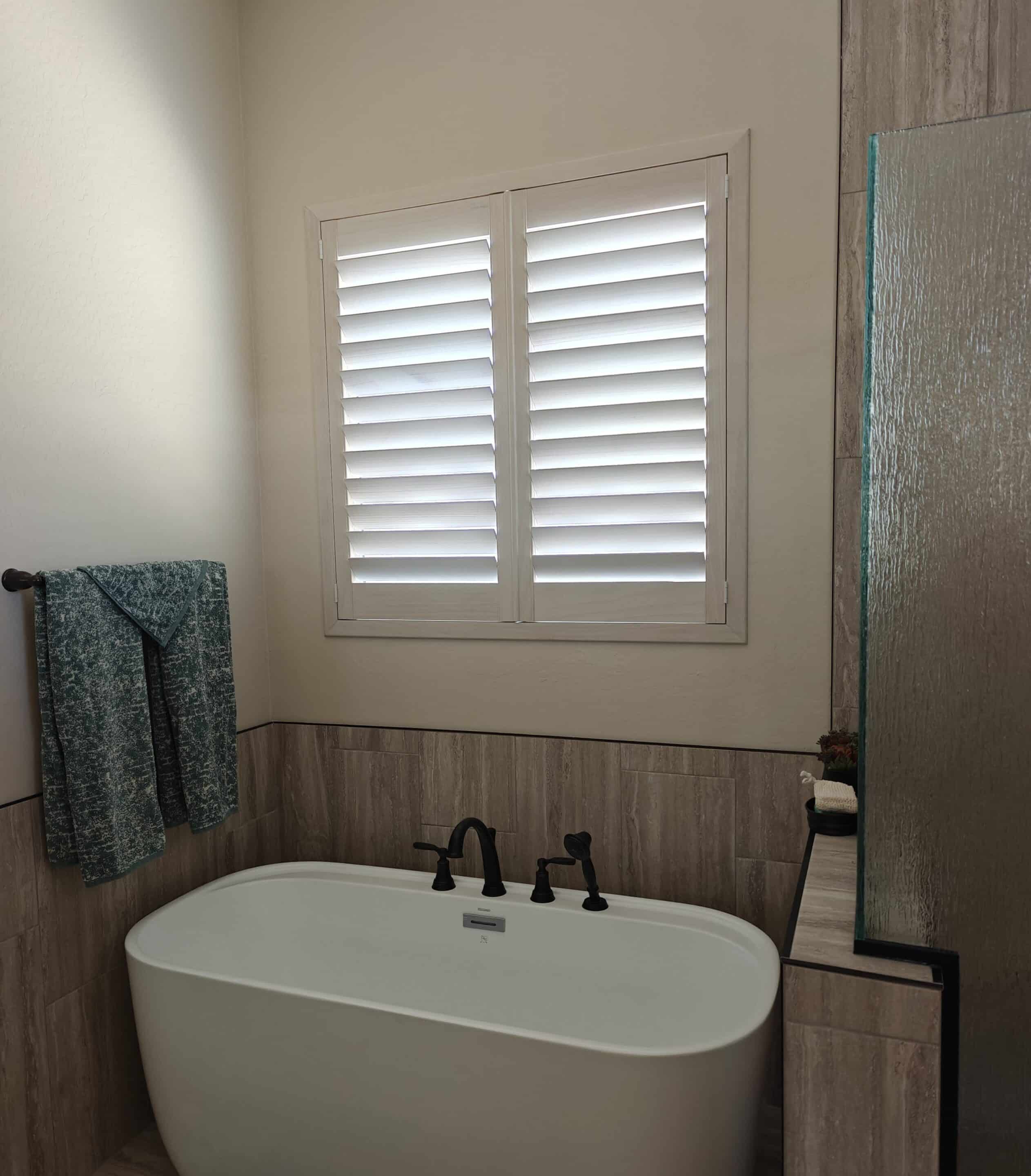 Composite white plantation shutter in Chino Valley AZ in a Bathroom.