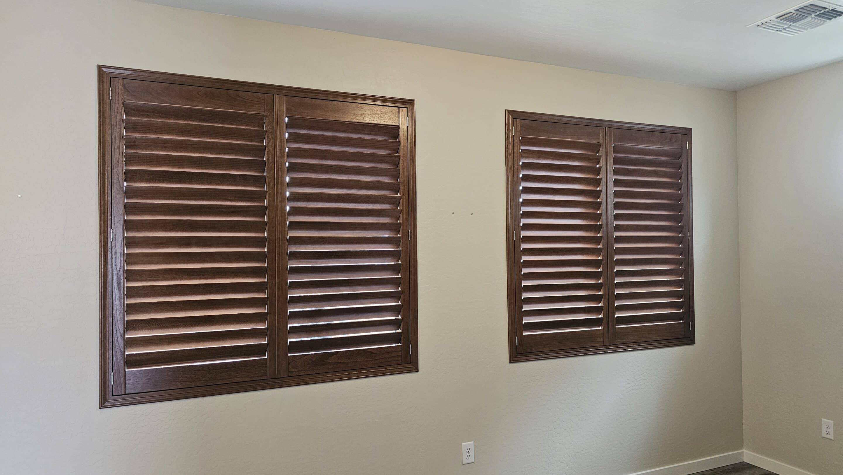 Stained wood plantation shutters in a home in Prescott Arizona.